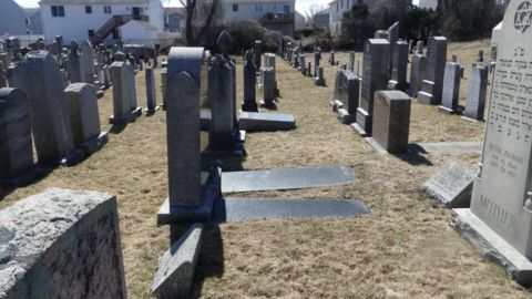 Fifty-nine gravesites at a Jewish cemetery in Fall River, Massachusetts, were desecrated with swastikas and anti-Semitic phrases, police said. 