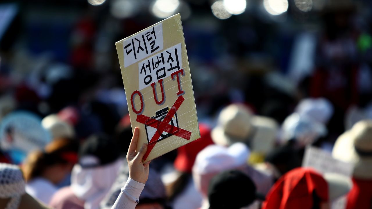 SEOUL, SOUTH KOREA - AUGUST 04: (SOUTH KOREA OUT)  South Korean women staging a protest against secretly-filmed hidden cameras pornography on August 4, 2018 in Seoul, South Korea. Female protesters gather in central Seoul urging the government to come up with measures to tackle sexual abuse involving hidden cameras as President Moon Jae-in called last month for tougher punishment for hidden camera crimes, including notifying perpetrators' employers of the crimes they committed.  (Photo by Chung Sung-Jun/Getty Images)