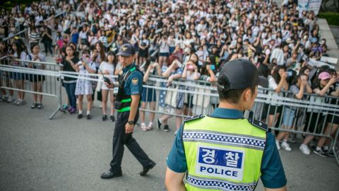 Fans wait to see K-Pop stars outside a concert in Suwon, South Korea, in 2016. 