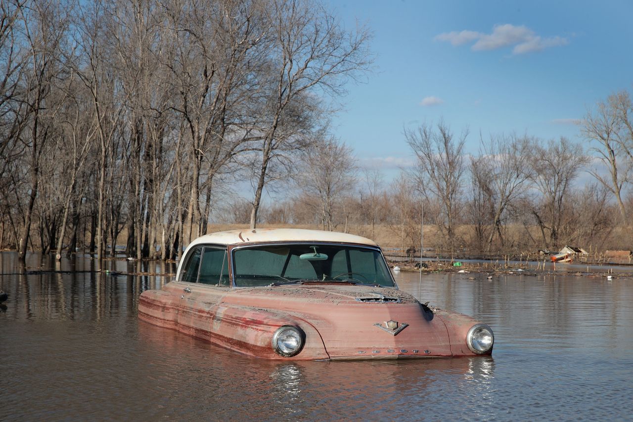 A vintage car sits in floodwaters in Hamburg on March 20.