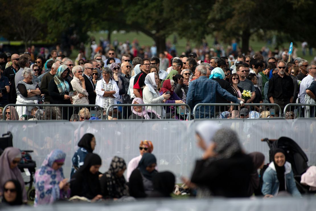 People gather for congregational Friday prayers by the Muslim community and a two-minute observation of silence at Hagley Park.
