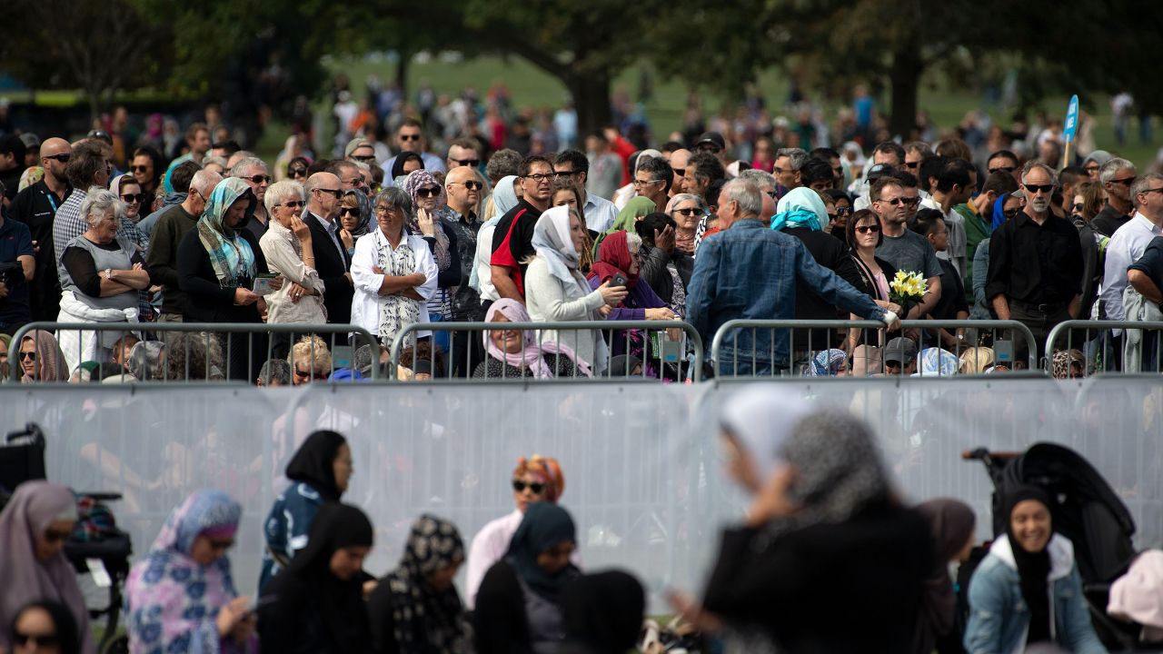 People gather for congregational Friday prayers by the Muslim community and a two-minute observation of silence at Hagley Park in Christchurch on March 22, 2019, one week on from the shootings that claimed 50 lives. - Thousands of New Zealanders gathered in Christchurch on March 22 to honour the 50 Muslim worshippers killed one week ago by a white supremacist, with a call to prayer broadcast around the country and a two-minute silence. (Photo by Marty MELVILLE / AFP)        (Photo credit should read MARTY MELVILLE/AFP/Getty Images)
