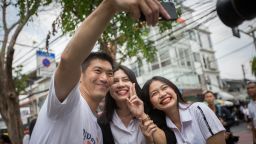 BANGKOK, THAILAND - 2019/02/21: Future Forward Party leader Thanathorn Juangroongruangkit seen taking selfie with students in front of the Suan Sunandha Rajabhat Dusit University in Bangkok.
Thai Police says that they were seeking the prosecution of Future Forward Party leader Thanathorn Juangroongruangkit after he allegedly posted a Facebook speech last June, criticising the military Junta, around a month before the long-delayed 2019 Thai general election. (Photo by Guillaume Payen/SOPA Images/LightRocket via Getty Images)
