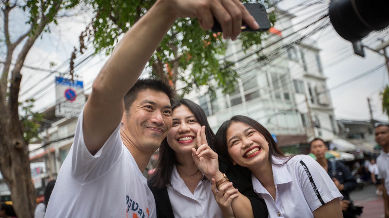 Future Forward Party leader Thanathorn Juangroongruangkit seen taking selfie with students in front of the Suan Sunandha Rajabhat Dusit University in Bangkok.
