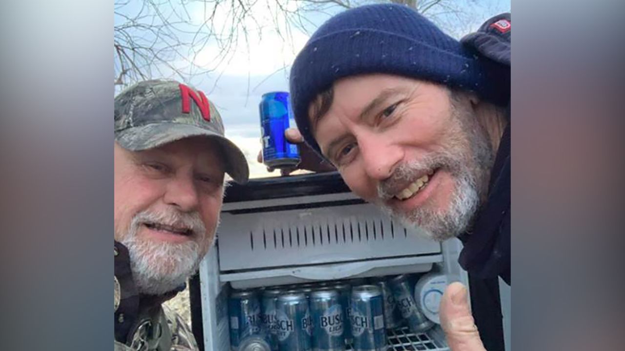 Kyle Simpson and Gayland Stouffer take a selfie with their beer discovery.