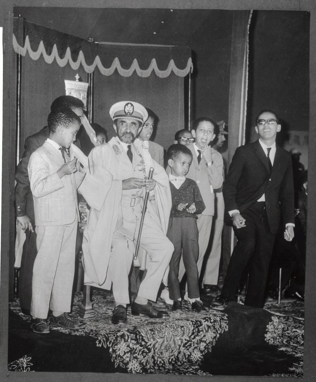 Emperor Haile Selassie and his grandchildren waiting for an Ethiopian Airlines jet. 