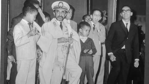 Emperor Haile Selassie and his grandchildren waiting for an Ethiopian Airlines jet. 