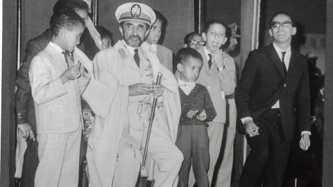 Emperor Haile Selassie and his grandchildren waiting for an Ethiopian Airlines jet.