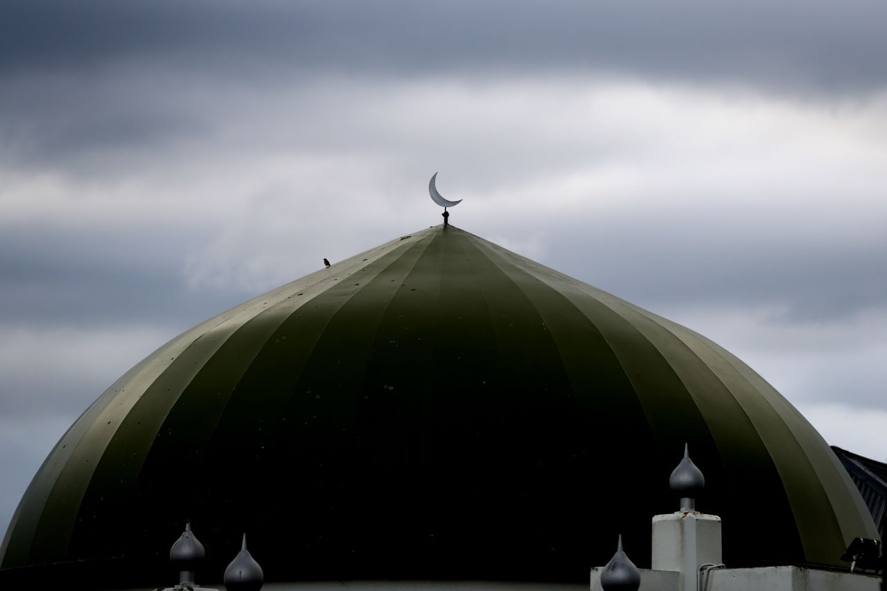 The sun sets behind Ponsonby Masjid Mosque during an open service for all religions on March 22 in Auckland, New Zealand's largest city.
