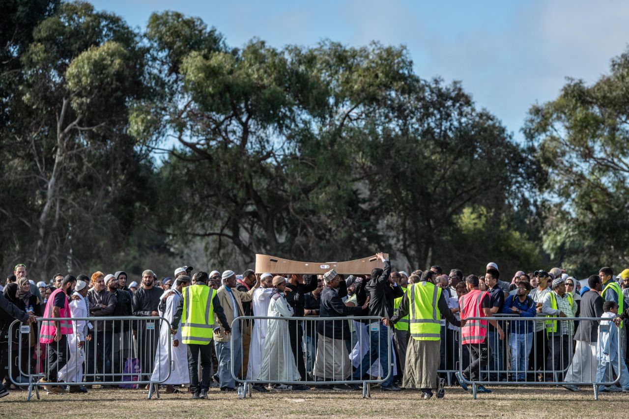 A coffin containing the body of a victim of the Christchurch mosque attacks is carried for burial at Memorial Park Cemetery on Friday in Christchurch, New Zealand.