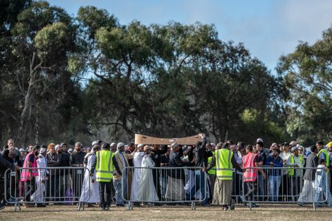  A coffin containing the body of a victim of the Christchurch mosque attacks is carried for burial at Memorial Park Cemetery on Friday in Christchurch, New Zealand. 
