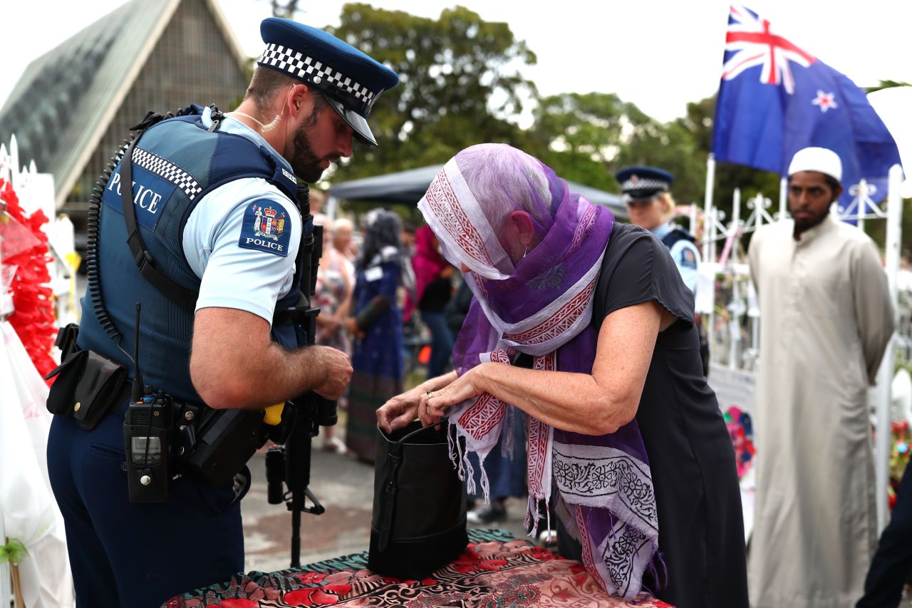 Police inspect bags of the guests arriving at the Ponsonby Masjid Mosque during an open service to all religions Friday in Auckland, New Zealand.