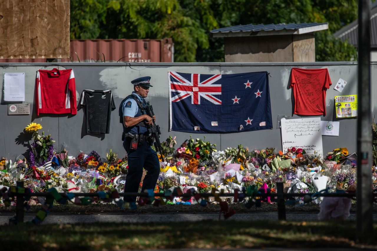 An armed police officer patrols near Al Noor mosque in Christchurch. 