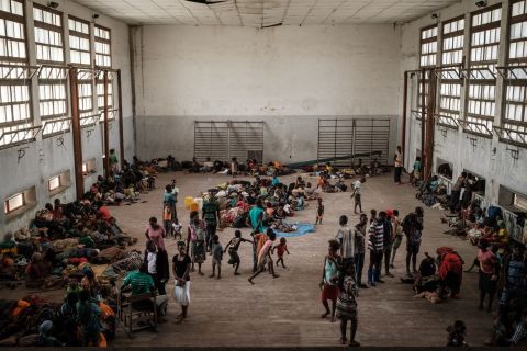 People from the isolated district of Buzi take shelter in the Samora M. Machel secondary school used as an evacuation center in Beira on March 21.