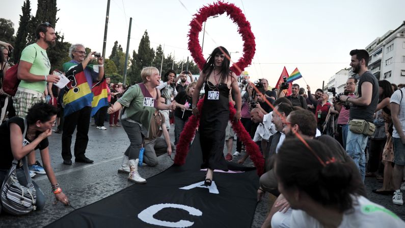 <strong>Fighting against HIV/AIDS</strong>. ACT UP (AIDS Coalition to Unleash Power) have often had a vocal presence at parades (including this one in Athens, Greece) to protest the high cost and lack of availability of HIV treatments, and to provide needed health care and hospice services.
