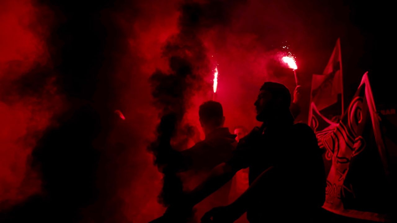 PSG fans light flares and smoke bombs outside the stadium after the UEFA Women's Champions League tie against Chelsea Women. 