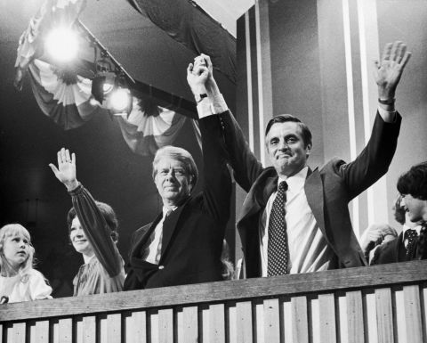 After becoming the Democratic Party's presidential nominee in 1976, Carter raises hands with running mate Walter Mondale at the Democratic National Convention in New York. Standing to Carter's right is his wife, Rosalynn, and their daughter, Amy. Carter ran as a Washington outsider and someone who promised to shake up government.