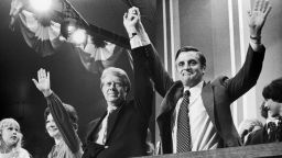 15th July 1976:  Democratic Presidential nominee Jimmy Carter raises hands with Vice Presidential nominee Walter Mondale (right) at the Democratic National Convention, New York City. Carter's wife, Rosalynn, and their daughter Amy, wave beside them.  (Photo by Hulton Archive/Getty Images)