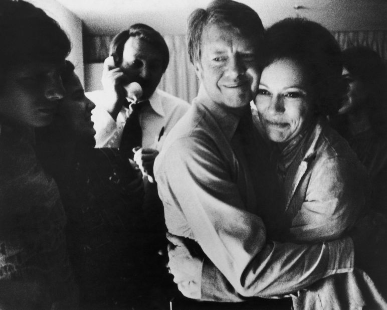 Carter embraces his wife after receiving news of his election victory on November 2, 1976. Carter received 297 electoral votes, while Ford received 241.