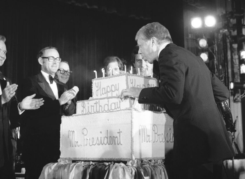Three days before his birthday in 1978, Carter blows out candles on a birthday cake presented to him at a fundraiser for the Democratic National Committee.