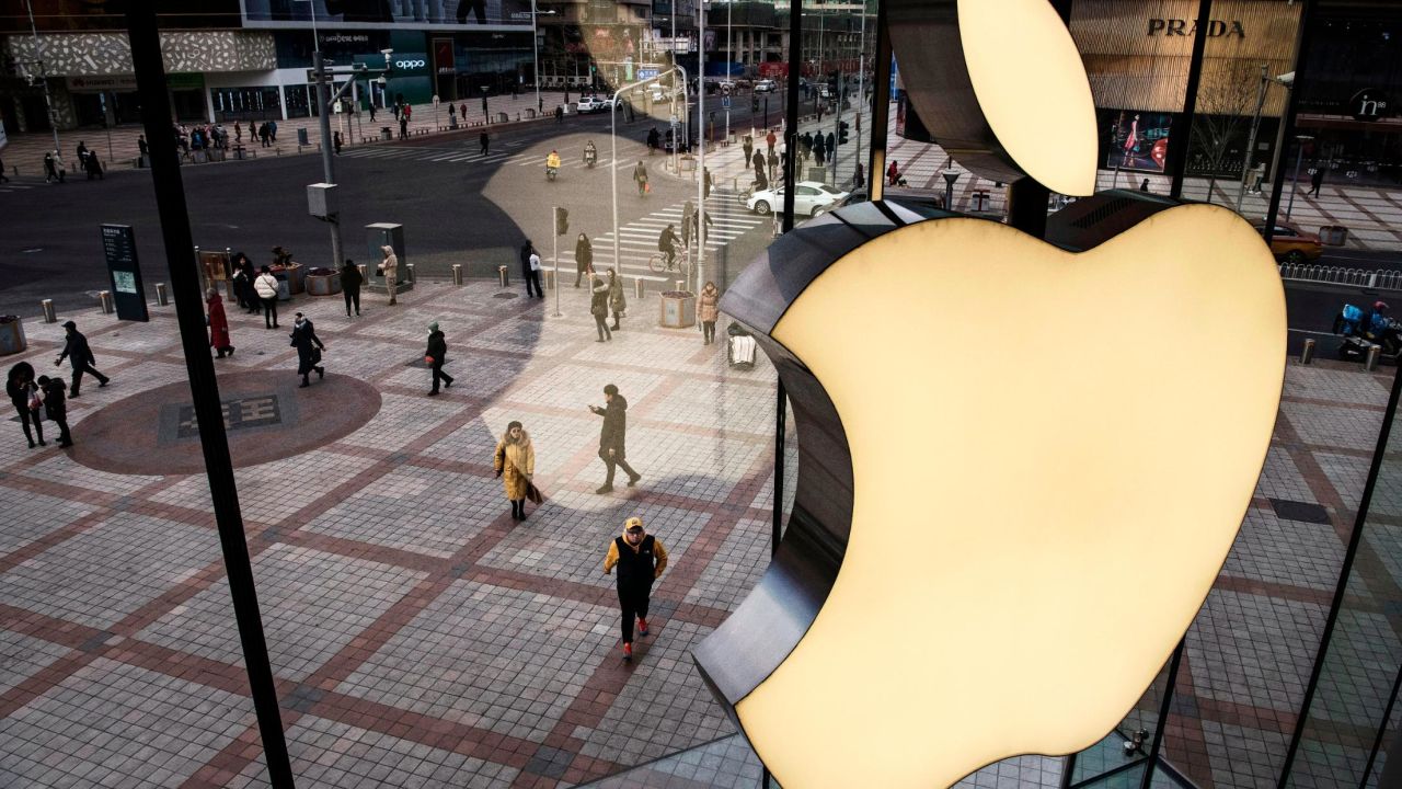 A logo on the window of an Apple Store in Beijing, China.