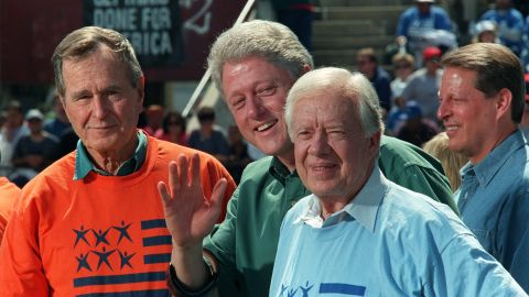 From left, former President George H.W. Bush, President Bill Clinton, Carter and Vice President Al Gore attend the Presidents' Summit for America's Future in Philadelphia in 1997. They helped clean up local neighborhoods as part of the effort to encourage volunteer service.