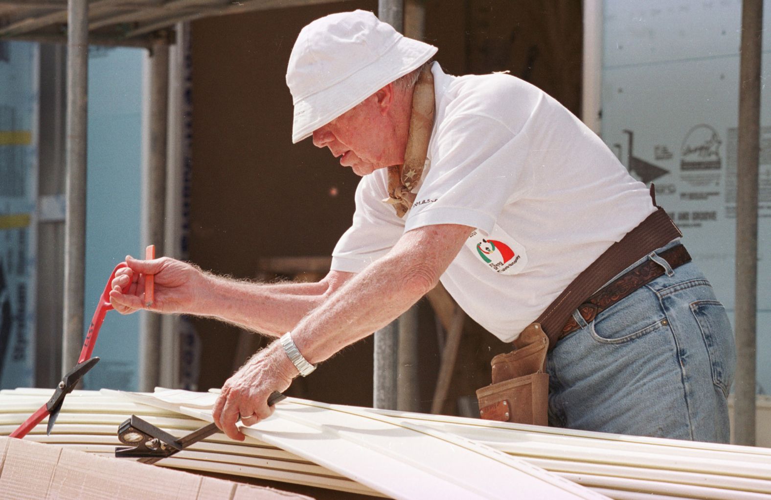 Carter works at a construction site sponsored by the Jimmy Carter Work Project in Asan, South Korea, in 2001. The Carters have been involved with the nonprofit Habitat for Humanity since 1984.