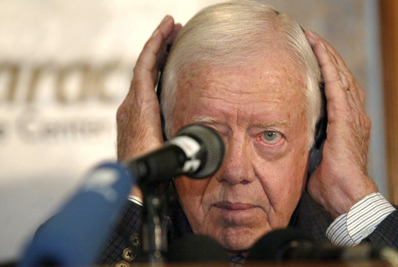 Carter adjusts his headphones at a news conference in Caracas, Venezuela, in January 2003. He proposed a referendum on Venezuelan President Hugo Chavez's presidency or an amendment to the constitution as a way to end the political crisis in the South American nation.