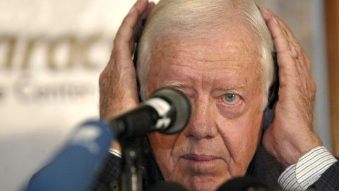 Carter adjusts his headphones at a news conference in Caracas, Venezuela, in January 2003. He proposed a referendum on Venezuelan President Hugo Chavez's presidency or an amendment to the constitution as a way to end the political crisis in the South American nation.