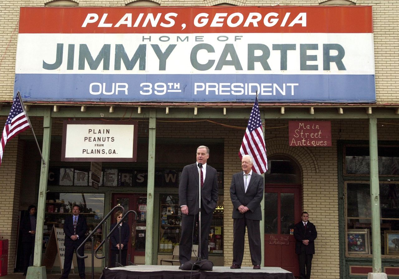 Democratic presidential candidate Howard Dean speaks beside Carter during a campaign stop in Plains, Georgia, in January 2004.