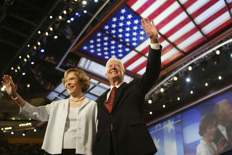 The Carters wave to the audience at the Democratic National Convention in Boston in 2004.