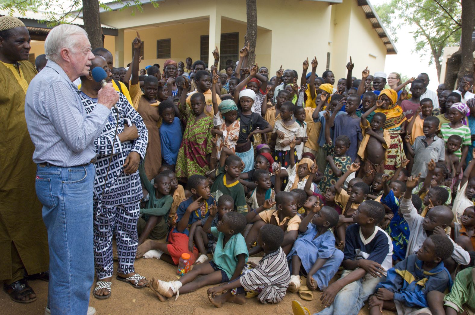 In February 2007, Carter speaks to children in Ghana on the seriousness of eradicating guinea worm disease.