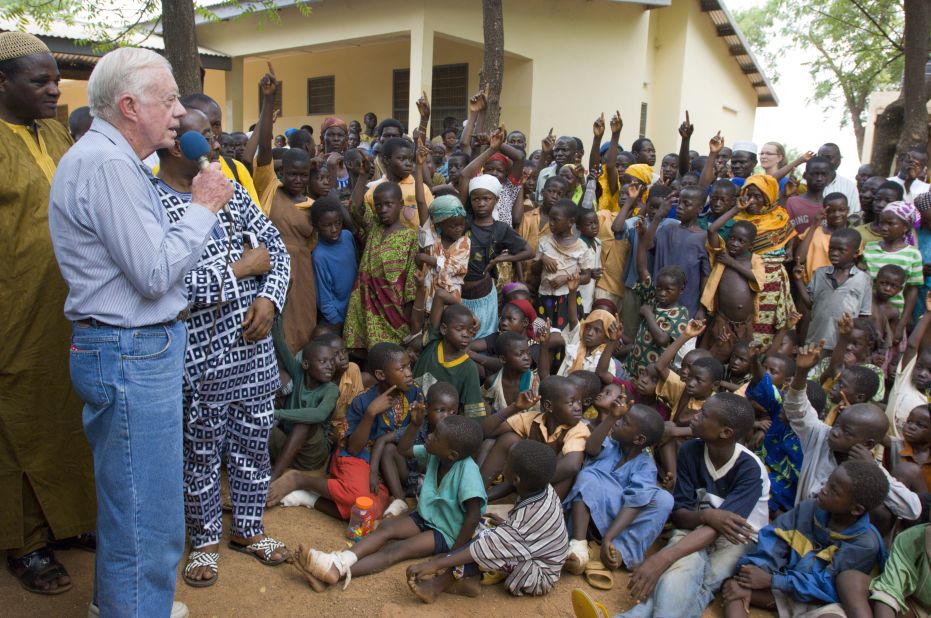 In February 2007, Carter speaks to children in Ghana on the seriousness of eradicating guinea worm disease.