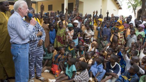 In February 2007, Carter speaks to children in Ghana on the seriousness of eradicating guinea worm disease.