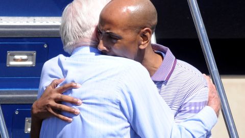 Carter hugs Aijalon Mahli Gomes at Boston's Logan International Airport in August 2010. Carter negotiated Gomes' release after he was held in North Korea for crossing into the country illegally in January 2010.