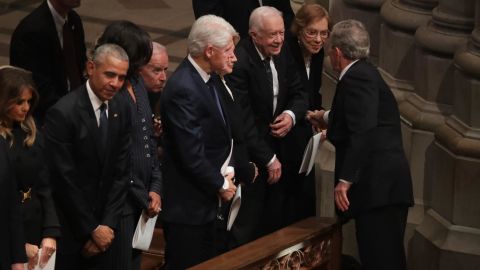 Former US President George W. Bush greets Carter and other former presidents during the state funeral for his father in December 2018.