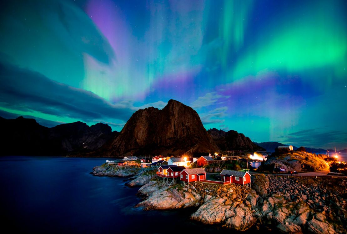The northern lights dance across the night sky, high in the Arctic Circle. 