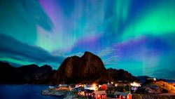 Northern lights (aurora borealis) illuminate the sky over Reinfjorden in Reine, on Lofoten Islands, Arctic Circle, on September 8, 2017. / AFP PHOTO / Jonathan NACKSTRAND        (Photo credit should read JONATHAN NACKSTRAND/AFP/Getty Images)