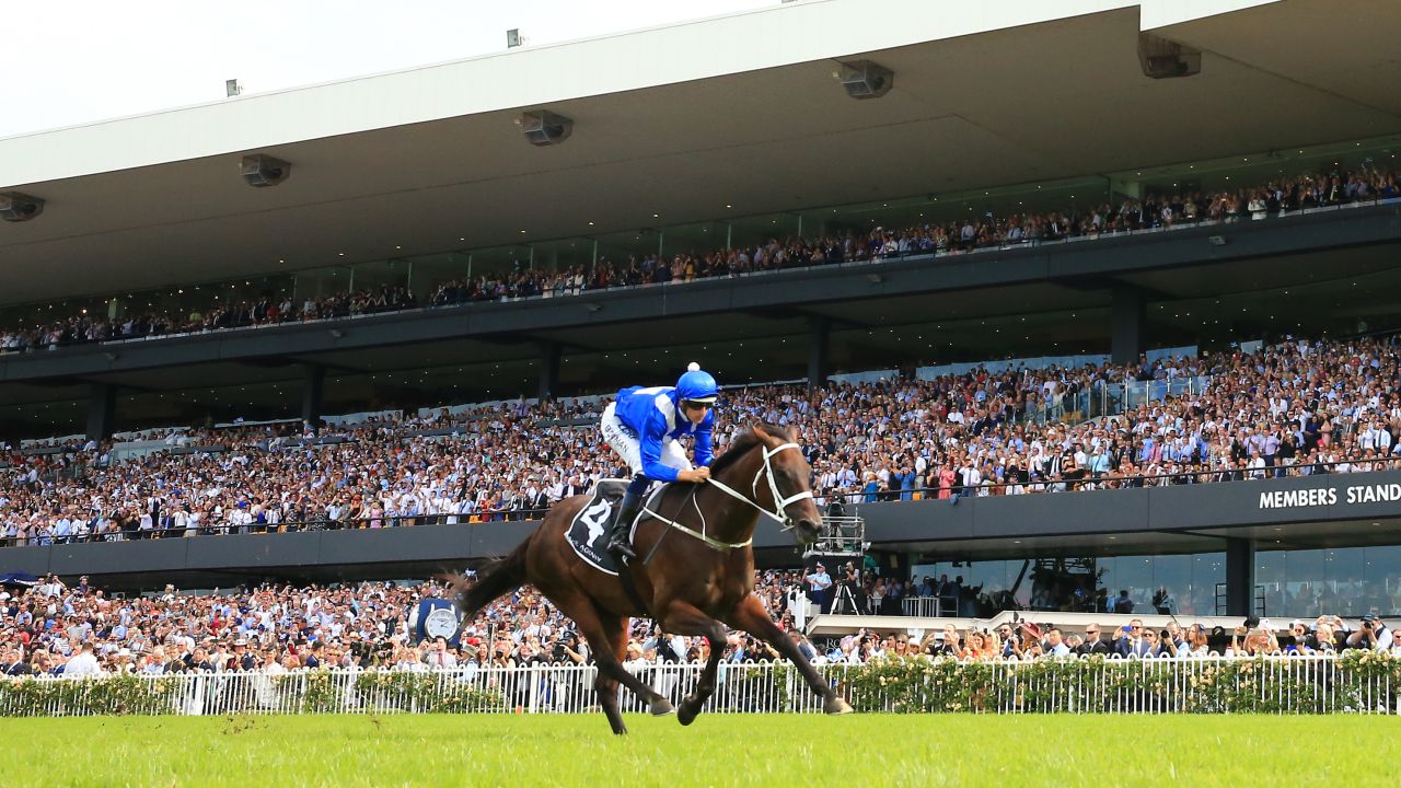 Winx and Hugh Bowman run clear at Rosehill.