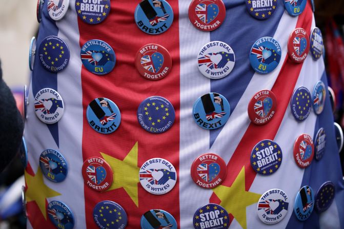 Anti-Brexit badges are displayed as people gather for the protest in London on March 23.