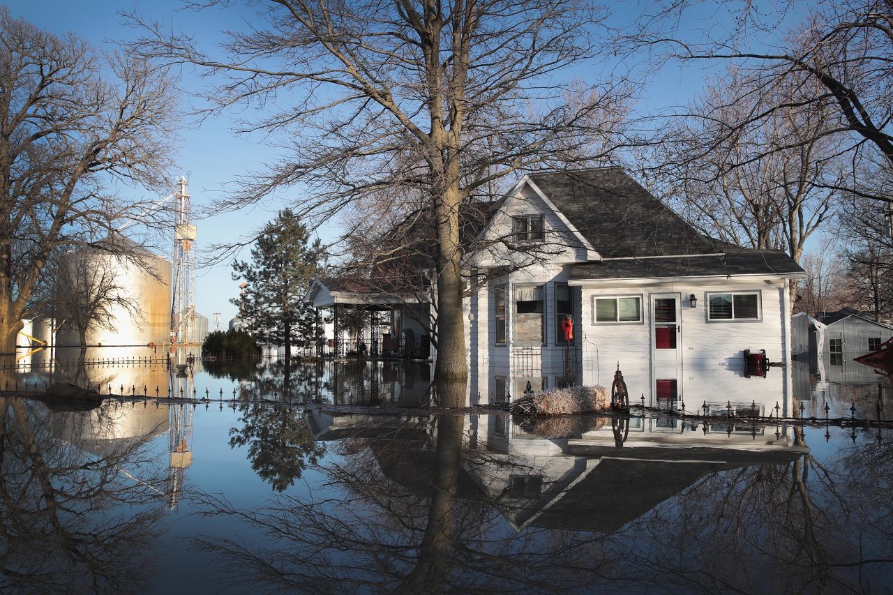 Water surrounds a house March 21 in Craig, a town suffering from heavy flooding.