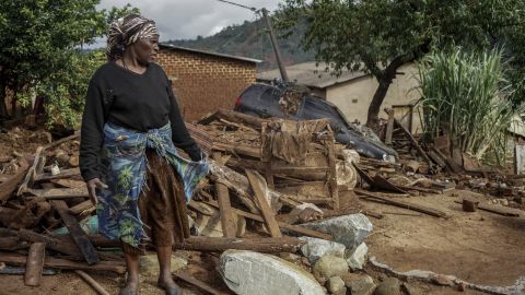 Jessica Mhonderi stands in front of what used to be her son's home in Chimanimani, Zimbabwe, on March 23.