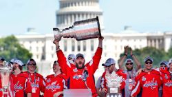 Washington Capitals' Alex Ovechkin, of Russia, holds up the Stanley Cup trophy during the NHL hockey team's Stanley Cup victory celebration, Tuesday, June 12, 2018, at the National Mall in Washington. The U.S. Capitol rises in the background. (AP Photo/Jacquelyn Martin)