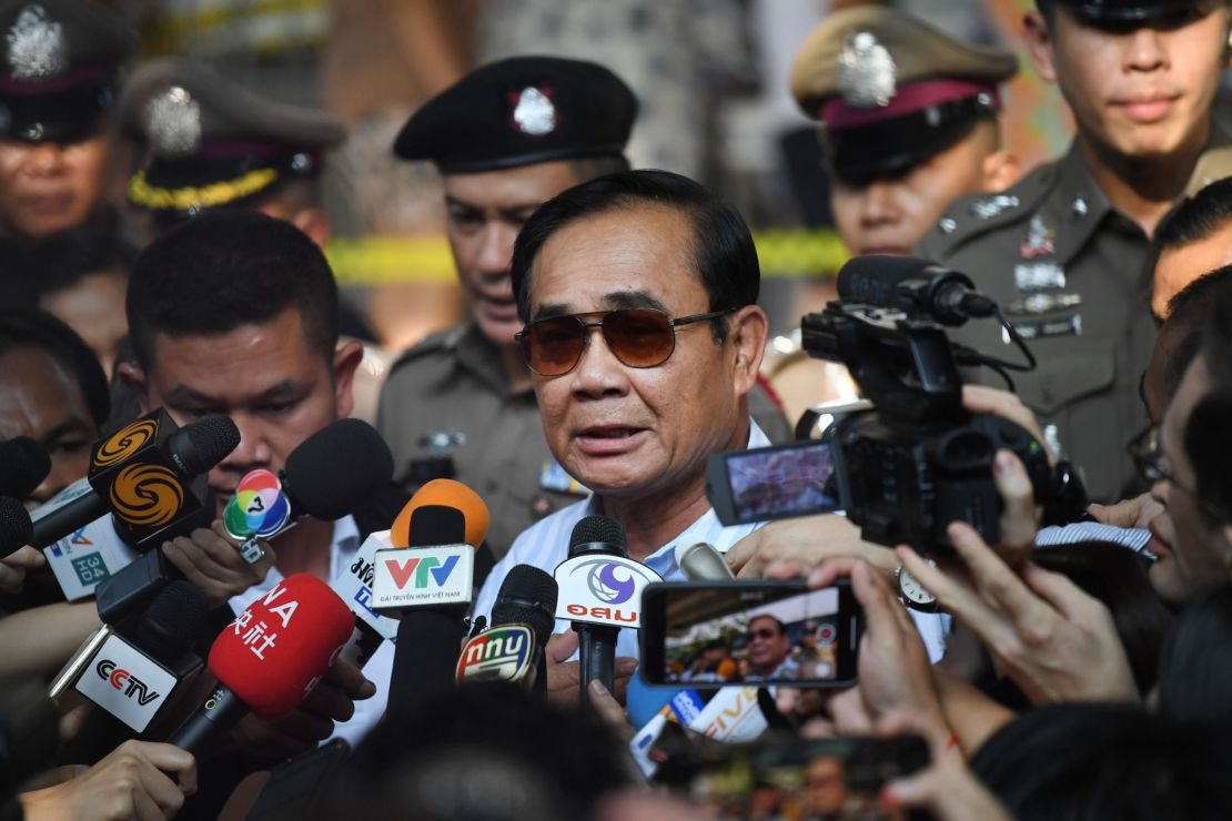 Prime Minister Prayut Chan-o-Cha talks to the media after casting his vote. 