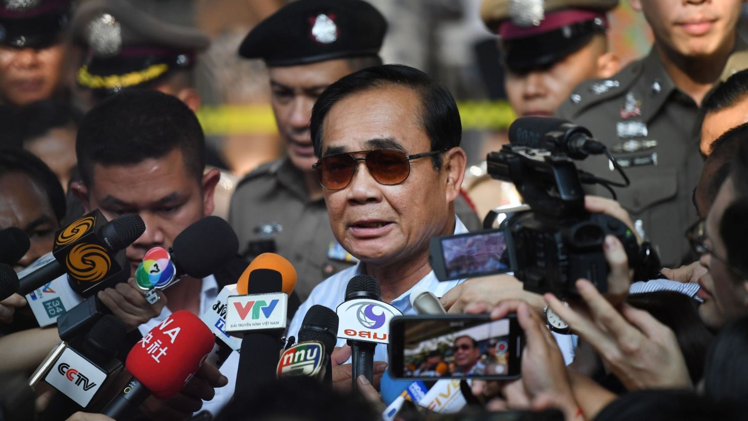 Thailand's Prime Minister Prayut Chan-O-Cha talks to the media after voting at a polling station in Bangkok on March 24, 2019 during Thailand's general election. 