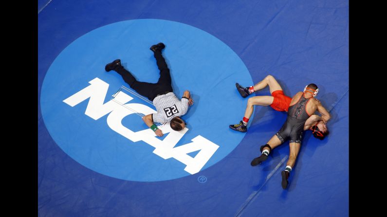 Nicholas Piccininni of Oklahoma State wrestles Korbin Meink of Campbell during the Division I Men's Wrestling Championship held at PPG Paints Arena in Pittsburgh on Thursday, March 21.