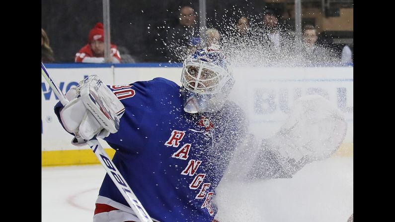 New York Rangers goaltender Henrik Lundqvist gets sprayed with ice in front of the net during the first period of a game against the Detroit Red Wings at Madison Square Garden on Tuesday, March 19.