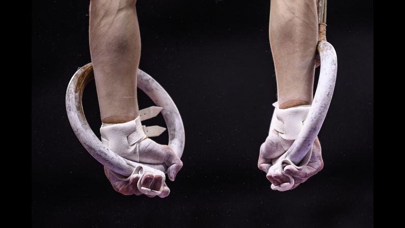 A gymnast competes on the rings during the Stuttgart World Cup gymnastics competition in Stuttgart, Germany on Sunday, March 17.