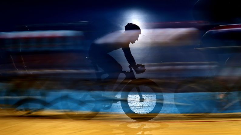 A cyclist competes during the Team Elimination on day three of the Phynova Six Day Manchester cycling event in Manchester, England on Sunday, March 24.