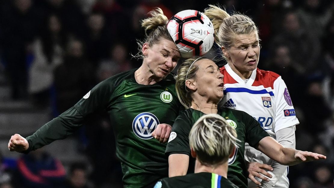 Hegerberg (R) heads the ball in a Champions League quarterfinal match against Wolfsberg.